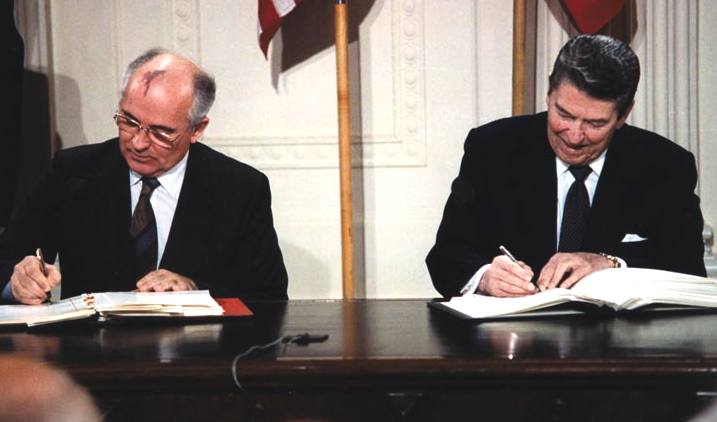 Gorbachev and Reagan signing the INF Agreement