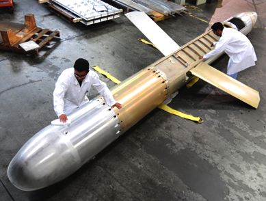 Technicians service a Tomahawk nuclear cruise missile