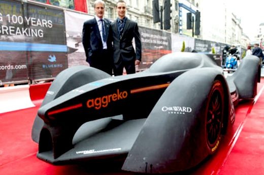 Father and son standing beside the batmobile gtl bluebird