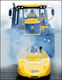 JCB digger pushing the Dieselmax