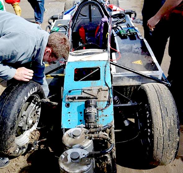 Wrecked electric vehicle on the sand at Pendine in 2011