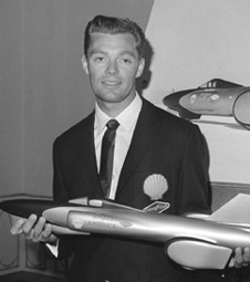 Craig Breedlove holding a model of Sprit of America