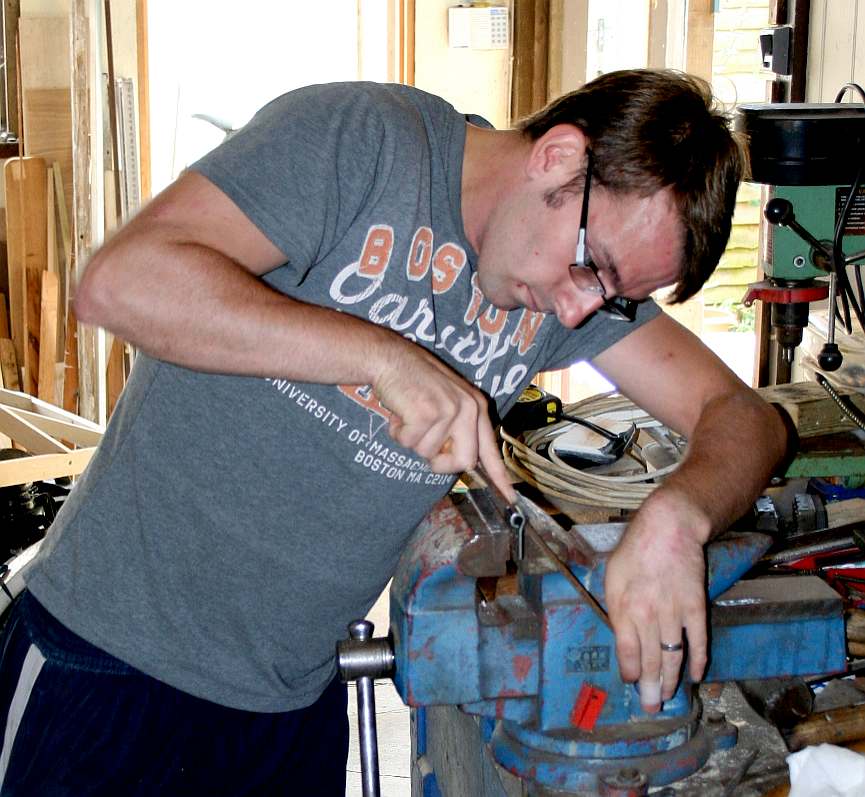 The project leader, Chris, making a hinge for the gull wing doors