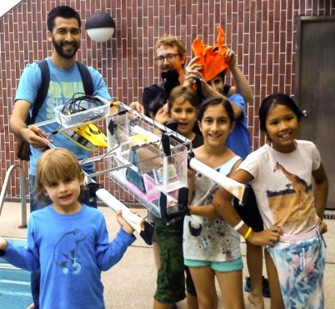 Students learning about robot boats