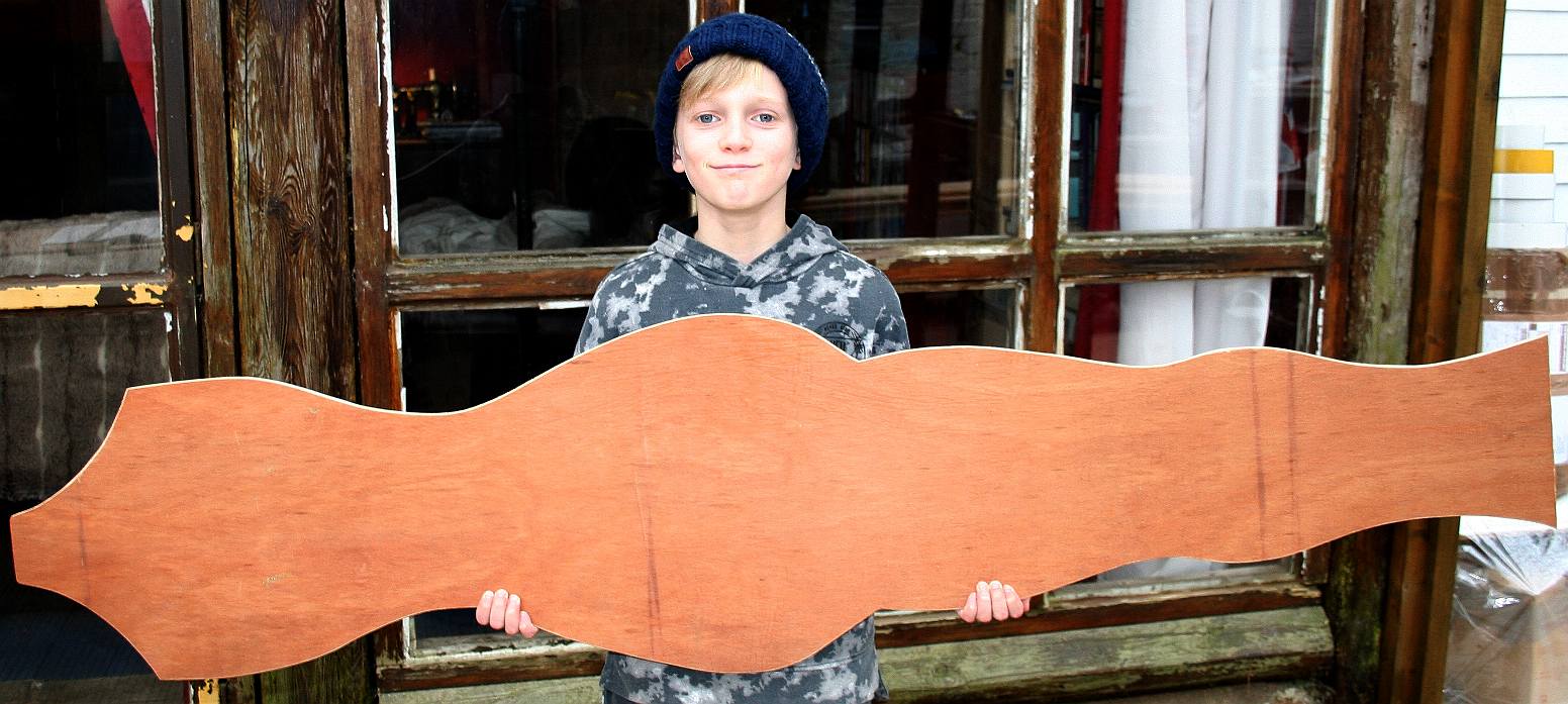 Fountain of Youth, Ryan Dusart holding a plywood former for the  Solar Lady figurehead