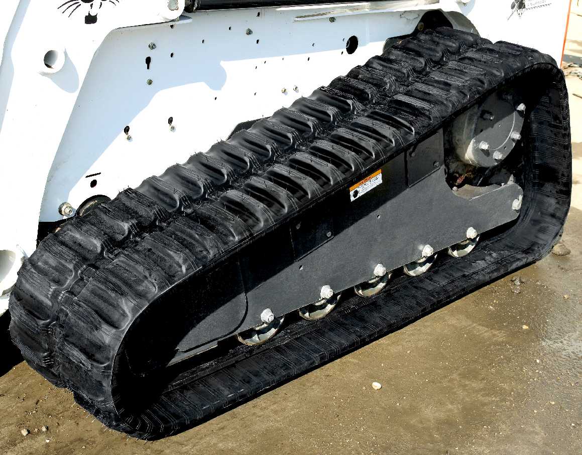 Rubber caterpillar tracks on a Bobcat earth mover