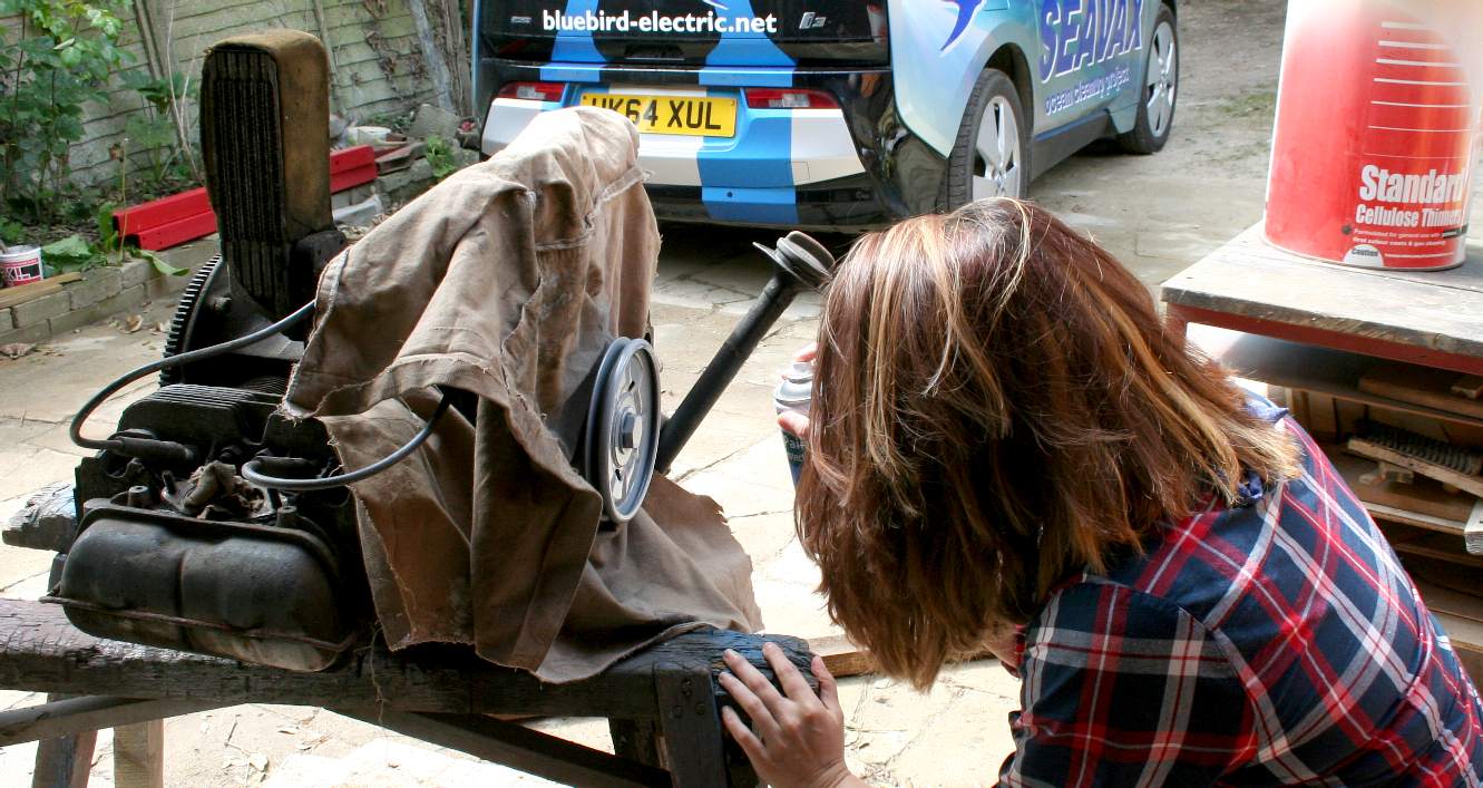 Kyla Harris learns how to apply primer to an air cooled VW engine