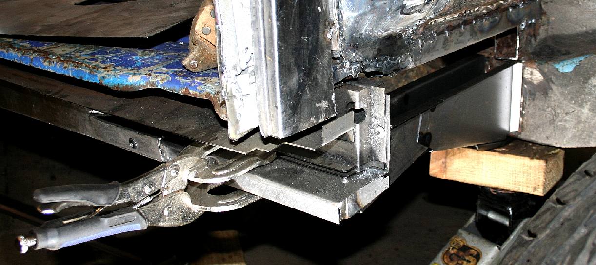 The jacking point chassis side beam is jigged in place.