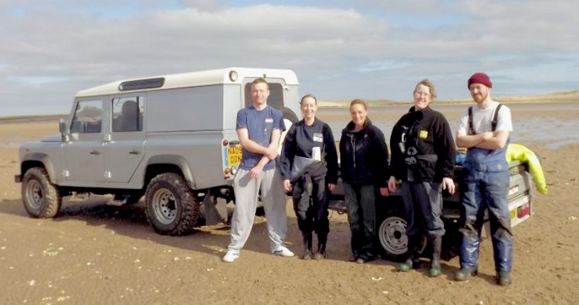 IFCA mussel survey team by their trusty Land Rover